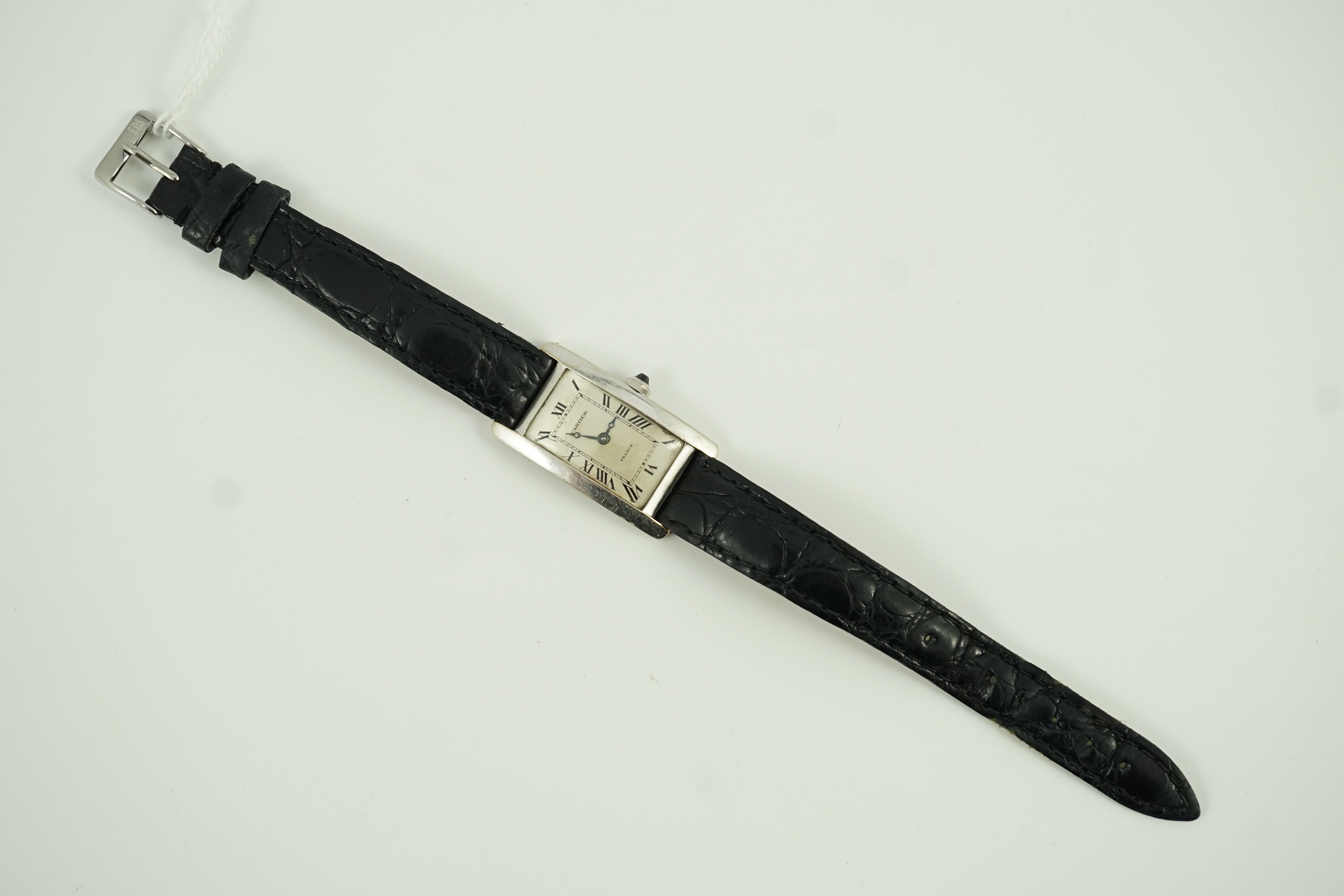 A 1920's 18ct white gold Cartier Tank Cintree (7 lignes model) manual wind wrist watch, with later 1970's movement and crown